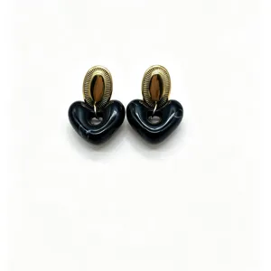 Close-up of elegant black resin heart earrings featuring gold-tone textured oval top studs.