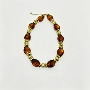 Bohemian amber resin and gold metal beaded necklace, stylish women's vacation jewelry.
