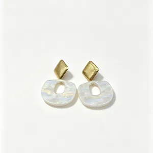 Elegant resin and metal earrings featuring geometric diamond and irregular oval designs.