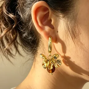 Exaggerated metal flower hoop earrings with chic bead pendant for stylish women summer daily wear.