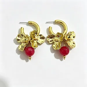 Gold metallic flower hoop earrings with striking red bead pendant for women summer chic.
