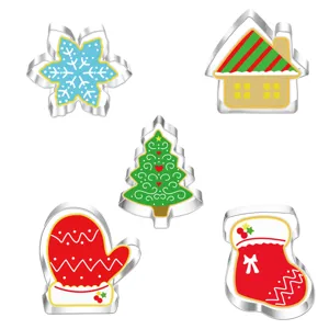 Detailed view of 5-piece Christmas stainless steel cookie cutters set, snowflake and tree shapes.