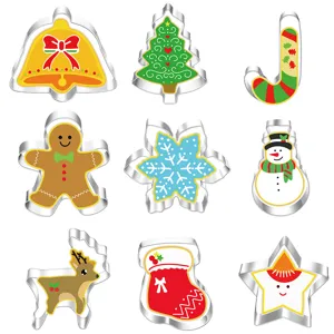 Detailed view of stainless steel Christmas cookie cutters set including tree, bell, and deer shapes.