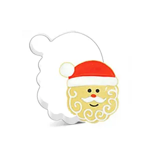 Stainless steel Santa Claus cookie cutter detail showing mold structure and decorated cookie design.
