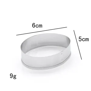Stainless steel oval cookie cutter detail shot showing 6cm length and 5cm width specs.