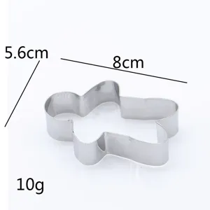 Stainless steel gingerbread man cookie cutter detail shot, sturdy baking tool for holidays.