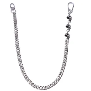 Detailed view of the punk metal pants chain featuring skull charms and secure clasps.