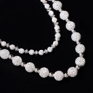 Detailed view of the double-layer rhinestone waist chain, featuring sparkling crystal balls.