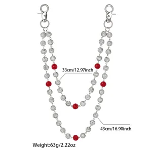 Detailed view of double layer rhinestone waist chain pants chain with red and silver crystal balls.