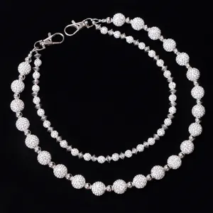 Detailed view of the sparkling rhinestone double layer hip hop waist chain for stylish jeans.