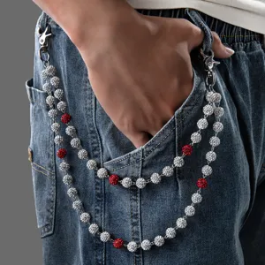 Detailed rhinestone hip hop waist chain, silver and red crystal ball punk jeans trouser accessory.