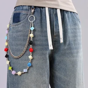 Close-up detail of trendy colorful square block double layer trouser chain hip hop.