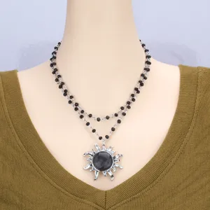 Double layer black beaded necklace with a statement sun pendant for women chic jewelry