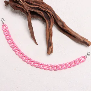Detailed close-up of pink rhinestone interlocked chain accessory with lobster clasps.
