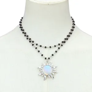 Elegant double layer black beaded necklace with glowing sun pendant detail for women fashion.