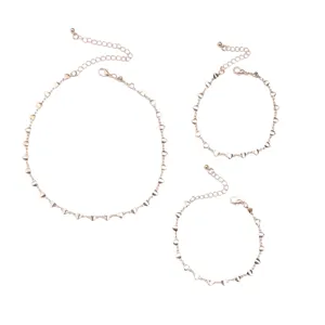 Detailed view of the cute rose gold heart charm chain set, delicate jewelry design.