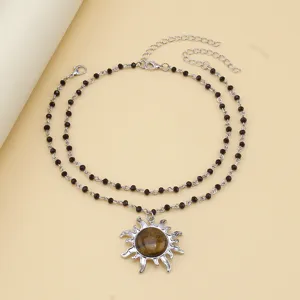 Double layer black bead necklace with sun pendant, elegant retro style jewelry for women.