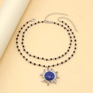 Double layered black beaded necklace with a stunning sun blue stone pendant for women fashion.