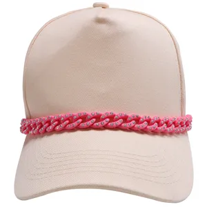 Close-up detail of beige baseball cap with pink rhinestone chain decoration stylish accessory