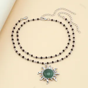 Elegant double layer black bead necklace with green sun pendant for women fashion jewelry.