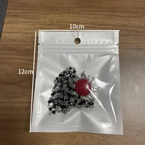 Exquisite sun pendant necklace featuring black beaded chain, packaged in a clear storage bag.