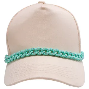 Beige baseball cap featuring a mint green rhinestone chunky chain detail for trendy look.