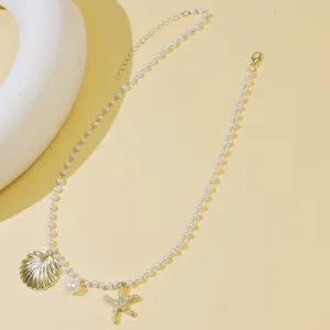 Exquisite ocean series pearl necklace with gold shell and starfish pendant, elegant style.