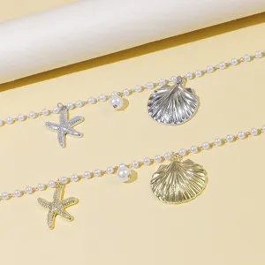Marine style pearl necklace featuring gold silver seashell and starfish pendants for women.