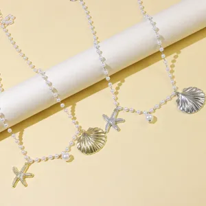 Ocean style pearl necklace with starfish and shell pendants, perfect for chic daily wear.