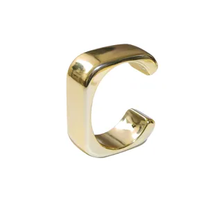 Gold open cuff bracelet detail view, minimalist wide metal band design, chic fashion jewelry.