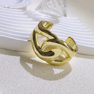 Wide gold-plated open cuff bracelet, minimalist chunky statement bangle for women.
