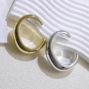 Exquisite detail of gold and silver chunky open cuffs, minimalist design fashion jewelry.