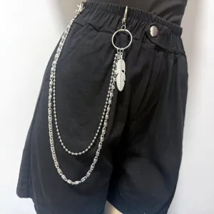 Multi-layer metal pants chain with feather pendant, punk style hip hop waist chain detail.
