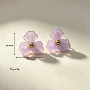 Lilac resin flower stud earrings with a gold center bead, sweet minimalist floral jewelry.