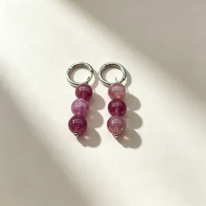 Exquisite natural stone beaded hoop earrings detail shot showcasing purple crystal sphere charms.