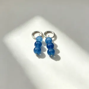 Blue natural stone bead detail earrings close-up, elegant unique hoop drop design.