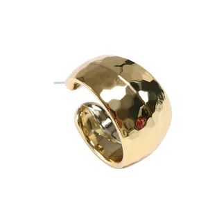 Chunky gold hammered hoop earrings for women, minimalist statement ear jewelry details.