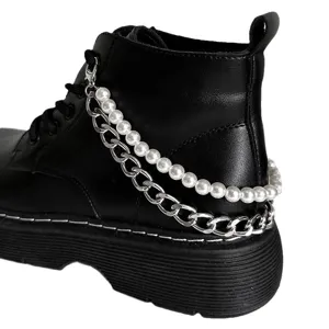 Classic black Martin boots with stylish double layer pearl and metal chain shoe accessories.