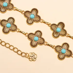 Detail view of the boho turquoise flower waist chain, showing delicate metal links and stones.