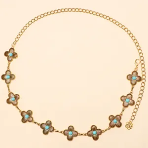 Bohemian vintage gold metal chain belt with turquoise stone floral charms for women daily wear.