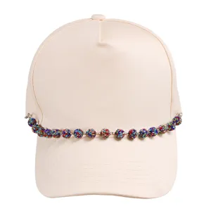 Trendy beige baseball cap accented with a gorgeous vibrant crystal ball chain accessory.