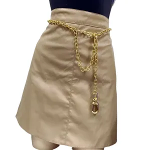 Close-up detail of the chunky gold metal waist chain with pendant, stylish streetwear accessory.