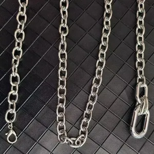 Silver metal chain accessory detail, cool waist chain links, high gloss silver finish.