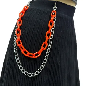 Double layer orange plastic and silver metal pant chain waist chain accessory detail view.