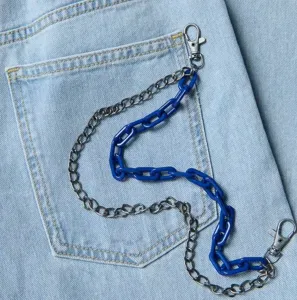 Detail shot of a trendy double-layer pant chain with metal and blue plastic links for style.