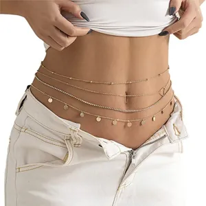 Detail shot of multi-layer gold waist chain and body chain, elegant beach bikini accessory for women.