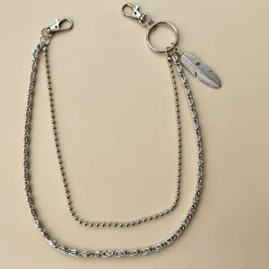 Punk style metal pants chain detail, multi-layer chain with feather pendant and secure clasps.