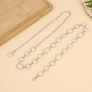 Detail shot of punk silver metal waist chain set, hip-hop circular rings pants chain for women.