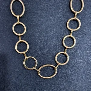 Detailed shot of a punk style gold metal chain belt, perfect for hip-hop waist styling.