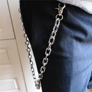 Close-up detail shot of a silver metal pants chain, stylish hip-hop hip style decoration.